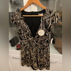 Beautiful gold Sequin Romper. Very flattering. New with tags.